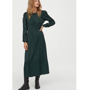 Calf length green jacquard-weave dress